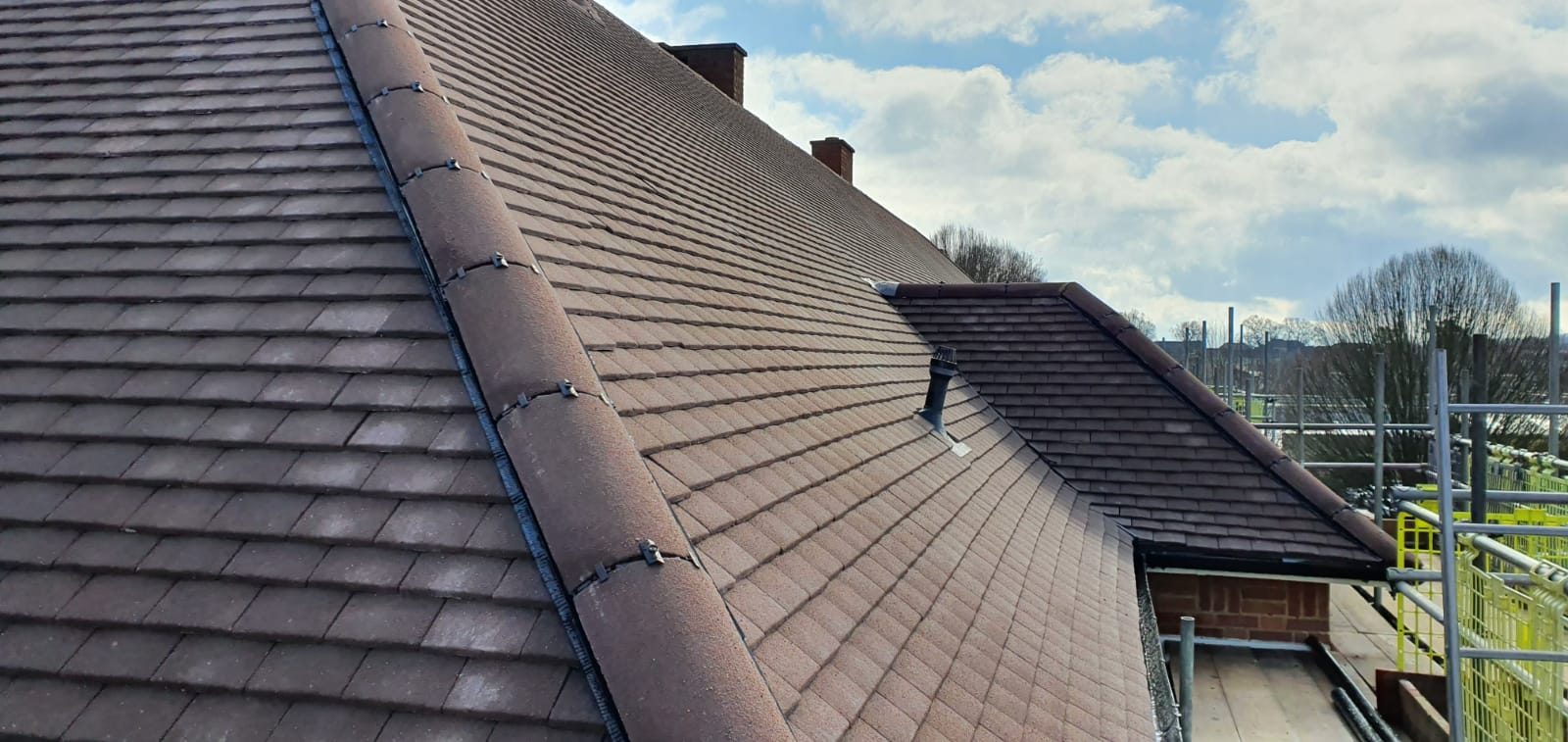 Completed - The completed tiled roof showing the new roof covering and neatly finished ridge tiles