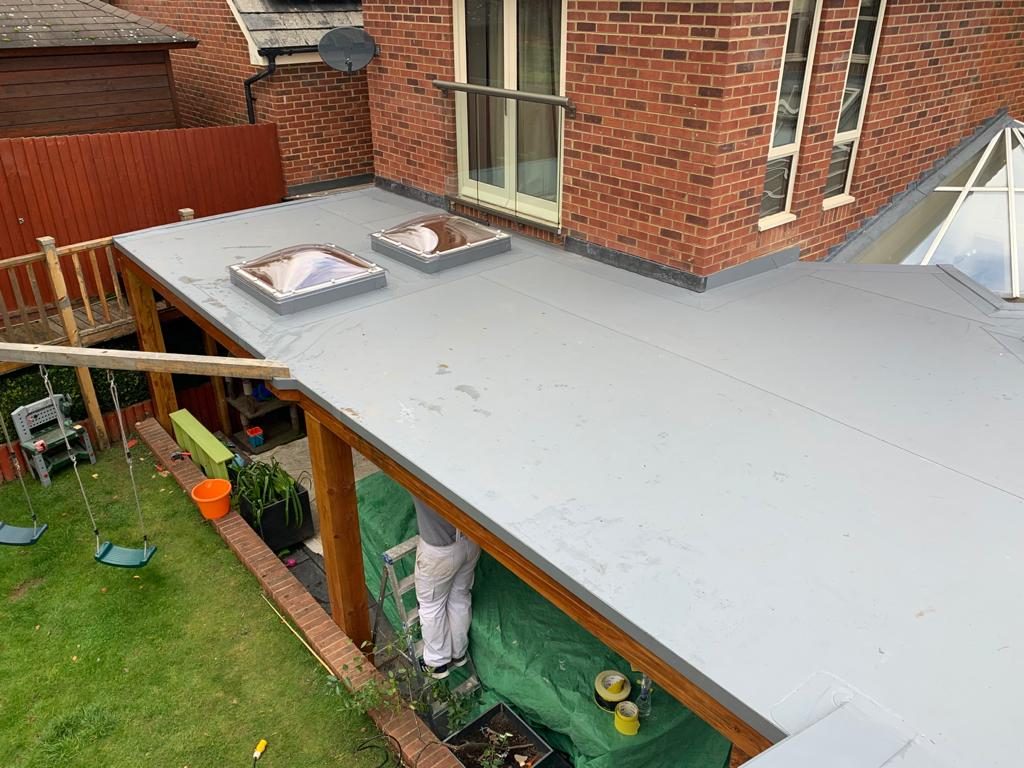 Completed - The completed single-ply flat roof with two rooflights and cleanly finished roof edges