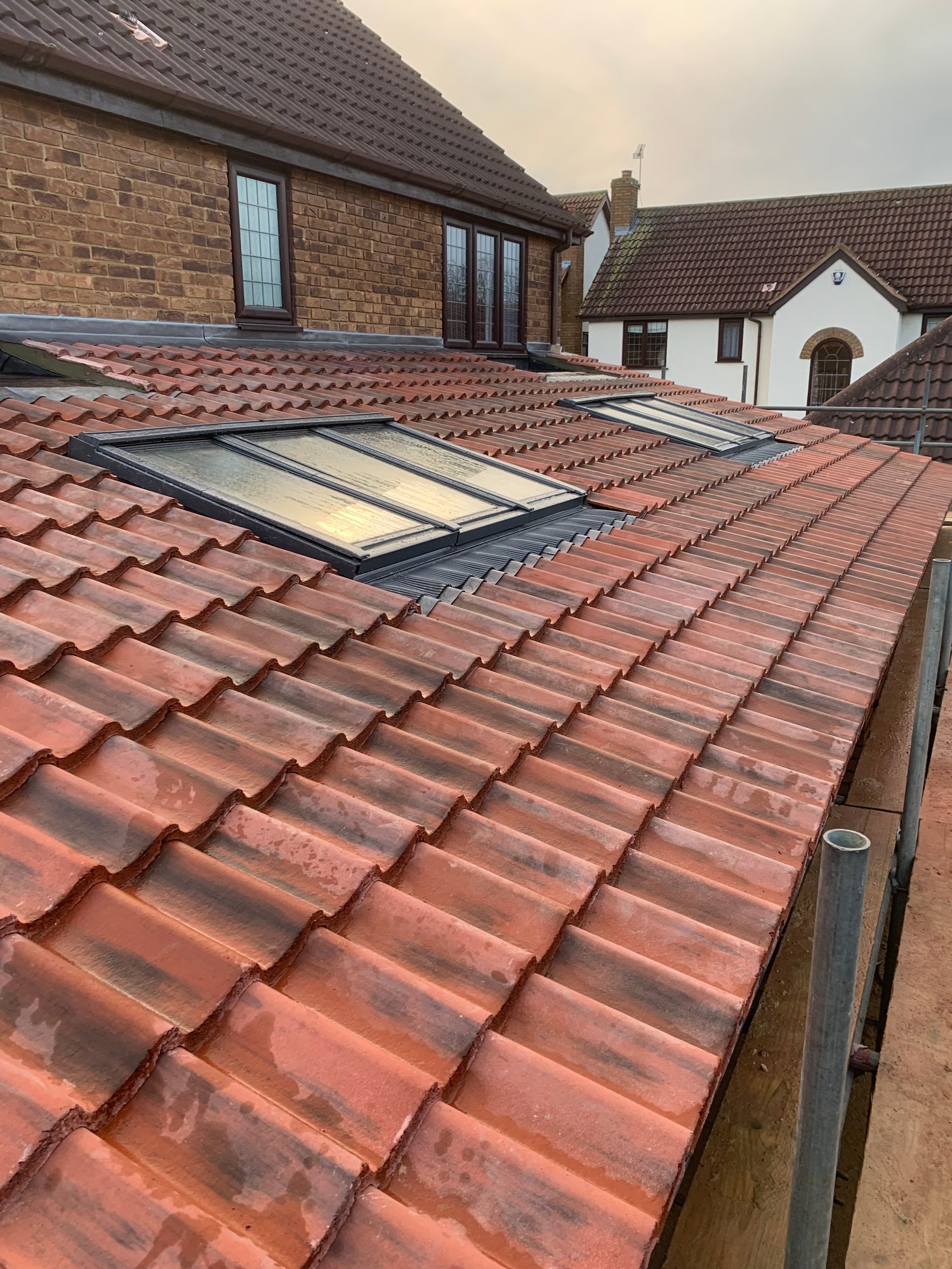 Completed - The completed tiled roof showing rooflights, leadwork and finished roof tiling