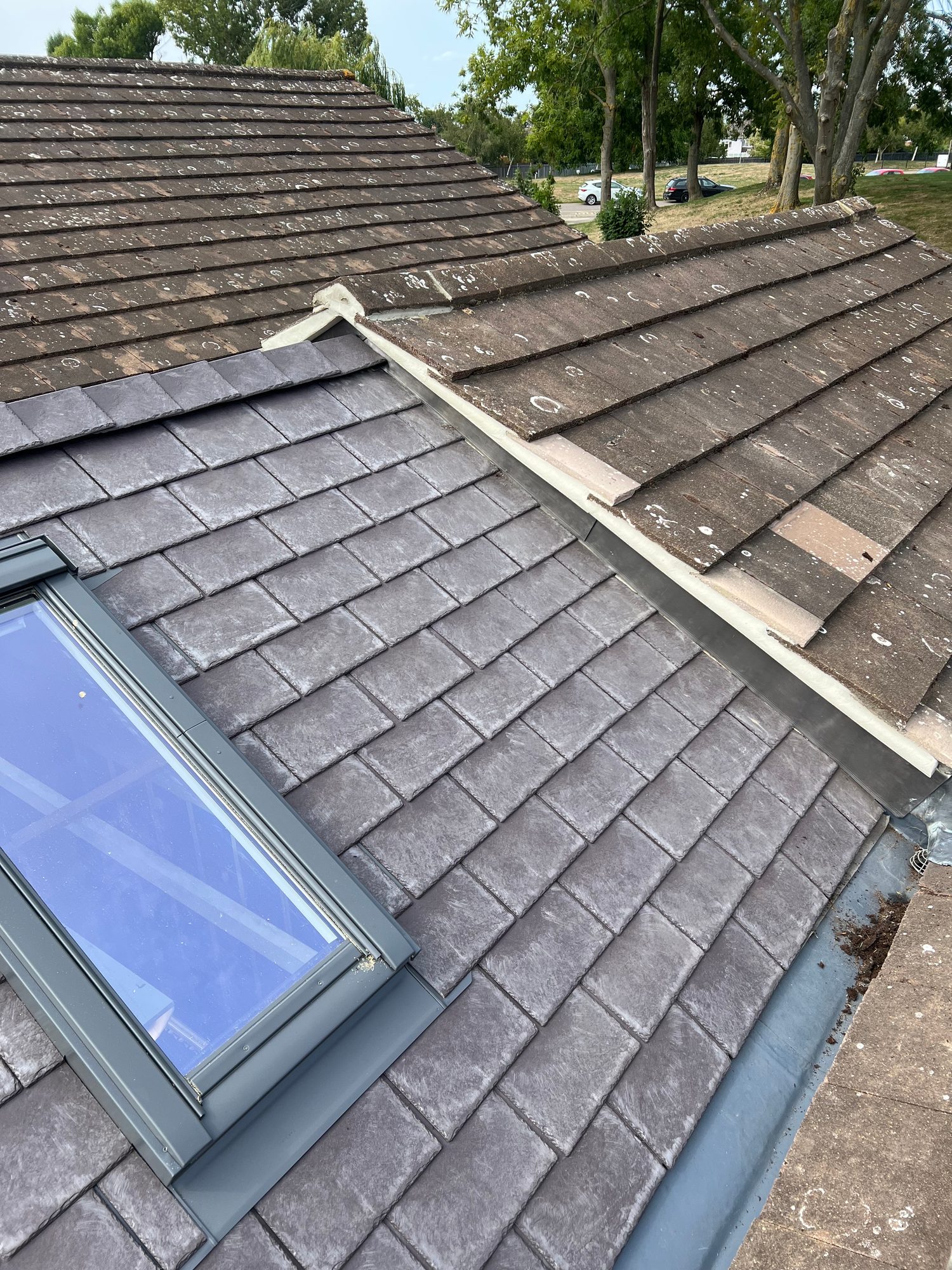 Completed - The completed tiled conservatory roof showing the new roof window, tiles and leadwork adjoining the existing roof