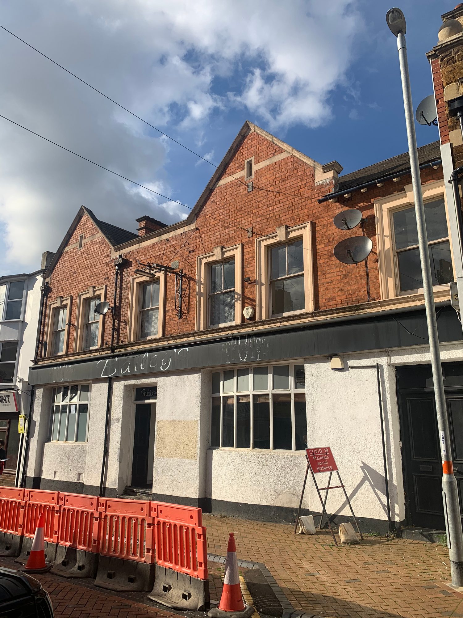 Before - The front of the property showing the original roof before the large slate roof replacement
