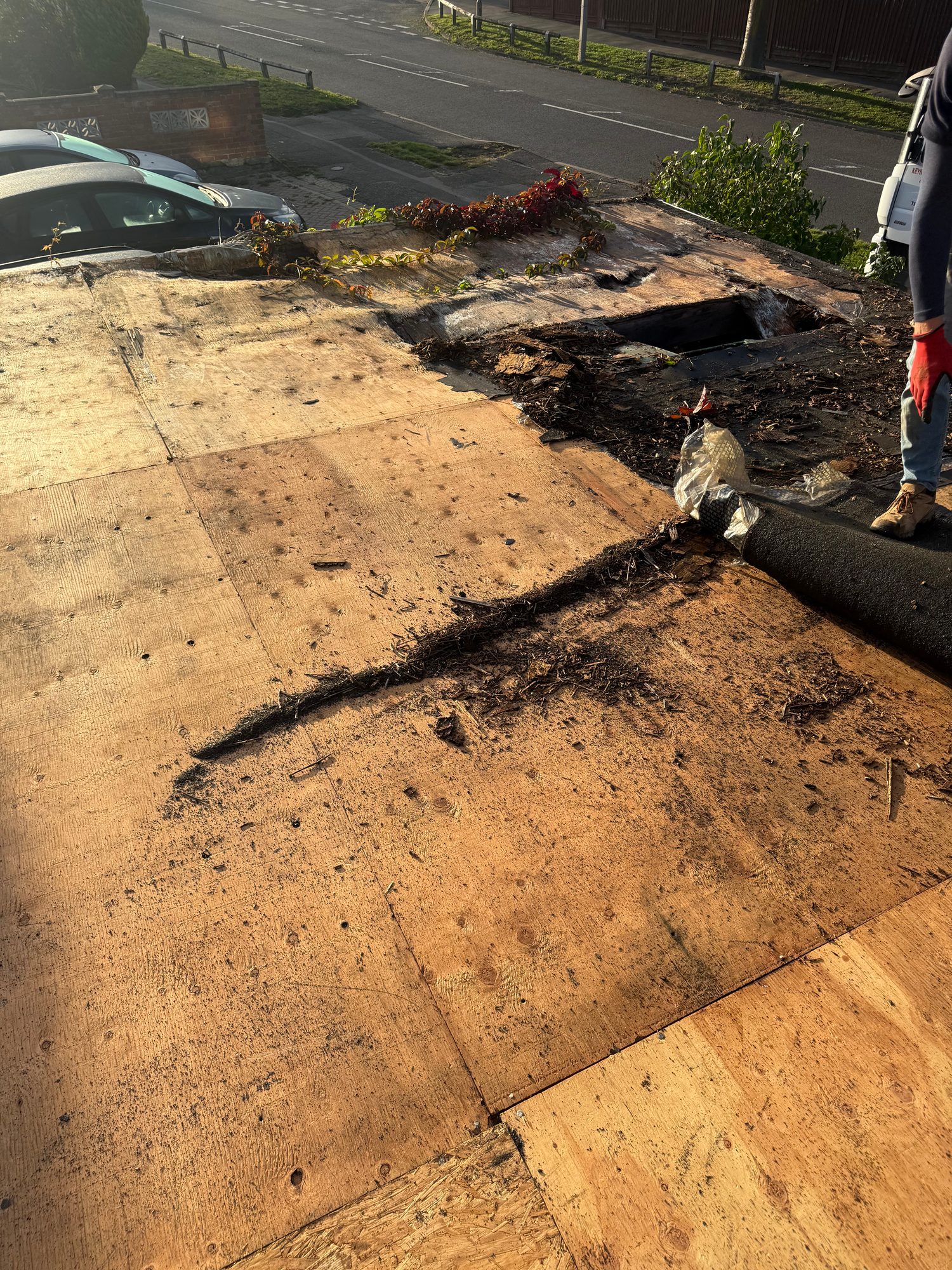 Removal of existing roof covering in progress